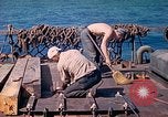 Image of U.S. Coast Guardsmen perform maintenance on LST  Iwo Jima, 1945, second 40 stock footage video 65675062154