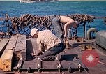 Image of U.S. Coast Guardsmen perform maintenance on LST  Iwo Jima, 1945, second 41 stock footage video 65675062154