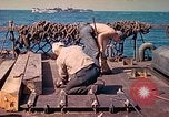 Image of U.S. Coast Guardsmen perform maintenance on LST  Iwo Jima, 1945, second 42 stock footage video 65675062154