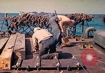 Image of U.S. Coast Guardsmen perform maintenance on LST  Iwo Jima, 1945, second 43 stock footage video 65675062154