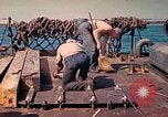 Image of U.S. Coast Guardsmen perform maintenance on LST  Iwo Jima, 1945, second 44 stock footage video 65675062154
