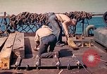 Image of U.S. Coast Guardsmen perform maintenance on LST  Iwo Jima, 1945, second 45 stock footage video 65675062154