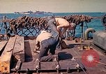 Image of U.S. Coast Guardsmen perform maintenance on LST  Iwo Jima, 1945, second 47 stock footage video 65675062154