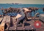 Image of U.S. Coast Guardsmen perform maintenance on LST  Iwo Jima, 1945, second 48 stock footage video 65675062154
