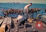 Image of U.S. Coast Guardsmen perform maintenance on LST  Iwo Jima, 1945, second 49 stock footage video 65675062154