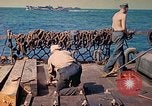 Image of U.S. Coast Guardsmen perform maintenance on LST  Iwo Jima, 1945, second 51 stock footage video 65675062154