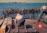 Image of U.S. Coast Guardsmen perform maintenance on LST  Iwo Jima, 1945, second 52 stock footage video 65675062154