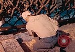 Image of U.S. Coast Guardsmen perform maintenance on LST  Iwo Jima, 1945, second 55 stock footage video 65675062154