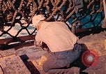 Image of U.S. Coast Guardsmen perform maintenance on LST  Iwo Jima, 1945, second 57 stock footage video 65675062154