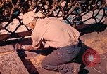 Image of U.S. Coast Guardsmen perform maintenance on LST  Iwo Jima, 1945, second 58 stock footage video 65675062154