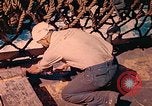 Image of U.S. Coast Guardsmen perform maintenance on LST  Iwo Jima, 1945, second 59 stock footage video 65675062154