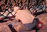 Image of U.S. Coast Guardsmen perform maintenance on LST  Iwo Jima, 1945, second 62 stock footage video 65675062154