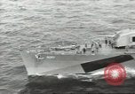 Image of Wounded transferred, ship-to-ship, on Stokes stretcher Mariana Islands, 1944, second 1 stock footage video 65675062229