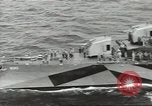 Image of Wounded transferred, ship-to-ship, on Stokes stretcher Mariana Islands, 1944, second 13 stock footage video 65675062229