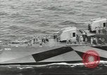 Image of Wounded transferred, ship-to-ship, on Stokes stretcher Mariana Islands, 1944, second 14 stock footage video 65675062229