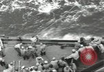 Image of Wounded transferred, ship-to-ship, on Stokes stretcher Mariana Islands, 1944, second 25 stock footage video 65675062229