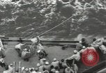 Image of Wounded transferred, ship-to-ship, on Stokes stretcher Mariana Islands, 1944, second 27 stock footage video 65675062229