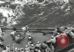 Image of Wounded transferred, ship-to-ship, on Stokes stretcher Mariana Islands, 1944, second 28 stock footage video 65675062229