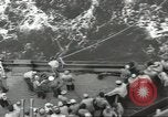 Image of Wounded transferred, ship-to-ship, on Stokes stretcher Mariana Islands, 1944, second 30 stock footage video 65675062229