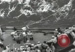 Image of Wounded transferred, ship-to-ship, on Stokes stretcher Mariana Islands, 1944, second 31 stock footage video 65675062229