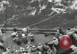 Image of Wounded transferred, ship-to-ship, on Stokes stretcher Mariana Islands, 1944, second 32 stock footage video 65675062229