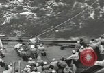 Image of Wounded transferred, ship-to-ship, on Stokes stretcher Mariana Islands, 1944, second 33 stock footage video 65675062229