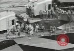 Image of Wounded transferred, ship-to-ship, on Stokes stretcher Mariana Islands, 1944, second 34 stock footage video 65675062229