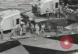 Image of Wounded transferred, ship-to-ship, on Stokes stretcher Mariana Islands, 1944, second 36 stock footage video 65675062229