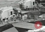 Image of Wounded transferred, ship-to-ship, on Stokes stretcher Mariana Islands, 1944, second 38 stock footage video 65675062229