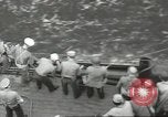 Image of Wounded transferred, ship-to-ship, on Stokes stretcher Mariana Islands, 1944, second 40 stock footage video 65675062229