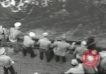 Image of Wounded transferred, ship-to-ship, on Stokes stretcher Mariana Islands, 1944, second 41 stock footage video 65675062229