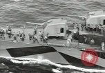 Image of Wounded transferred, ship-to-ship, on Stokes stretcher Mariana Islands, 1944, second 51 stock footage video 65675062229