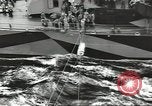 Image of Transferring wounded between ships on Stokes stretcher Mariana Islands, 1944, second 4 stock footage video 65675062231