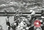 Image of Transferring wounded between ships on Stokes stretcher Mariana Islands, 1944, second 11 stock footage video 65675062231
