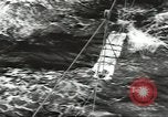 Image of Transferring wounded between ships on Stokes stretcher Mariana Islands, 1944, second 13 stock footage video 65675062231