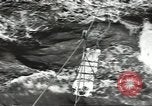 Image of Transferring wounded between ships on Stokes stretcher Mariana Islands, 1944, second 14 stock footage video 65675062231