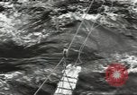 Image of Transferring wounded between ships on Stokes stretcher Mariana Islands, 1944, second 15 stock footage video 65675062231