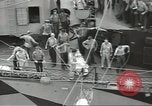 Image of Transferring wounded between ships on Stokes stretcher Mariana Islands, 1944, second 21 stock footage video 65675062231