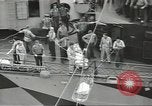 Image of Transferring wounded between ships on Stokes stretcher Mariana Islands, 1944, second 22 stock footage video 65675062231