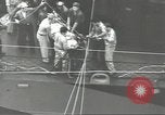 Image of Transferring wounded between ships on Stokes stretcher Mariana Islands, 1944, second 31 stock footage video 65675062231