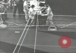 Image of Transferring wounded between ships on Stokes stretcher Mariana Islands, 1944, second 36 stock footage video 65675062231