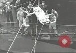 Image of Transferring wounded between ships on Stokes stretcher Mariana Islands, 1944, second 40 stock footage video 65675062231
