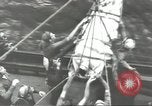 Image of Transferring wounded between ships on Stokes stretcher Mariana Islands, 1944, second 45 stock footage video 65675062231
