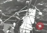 Image of Transferring wounded between ships on Stokes stretcher Mariana Islands, 1944, second 46 stock footage video 65675062231