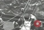 Image of Transferring wounded between ships on Stokes stretcher Mariana Islands, 1944, second 48 stock footage video 65675062231