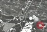Image of Transferring wounded between ships on Stokes stretcher Mariana Islands, 1944, second 49 stock footage video 65675062231