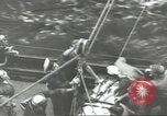 Image of Transferring wounded between ships on Stokes stretcher Mariana Islands, 1944, second 50 stock footage video 65675062231
