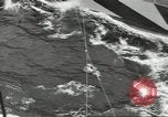 Image of Transferring wounded between ships on Stokes stretcher Mariana Islands, 1944, second 55 stock footage video 65675062231