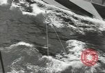 Image of Transferring wounded between ships on Stokes stretcher Mariana Islands, 1944, second 61 stock footage video 65675062231