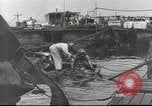 Image of Devastation from Japanese attack on Pearl Harbor Pearl Harbor Hawaii USA, 1941, second 52 stock footage video 65675062272